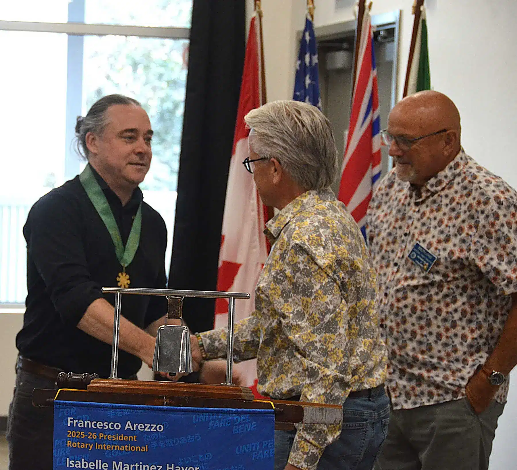 Jared Mumford at the Rotary Club of, no, Jared Mumford shaking hands with Mayor Ken Popove while receiving the Order of Chilliwack on behalf of the Rotary Club of Chilliwack at Jared's presidential installation. Dr. Ralph Jones is also in the photo.