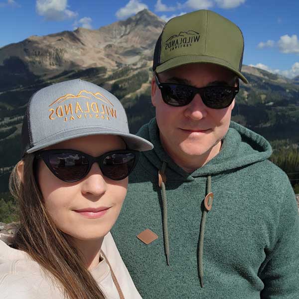 Picture of Jared Mumford and Salina Derish wearing sunglasses on the top of Lone Mountain.